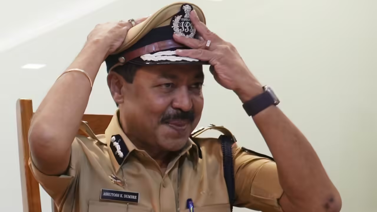 Ashutosh Dumbare in Maharashtra Police uniform, wearing his peaked cap, during an official engagement.