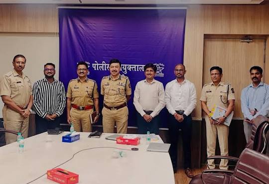 Ashutosh Dumbare with Maharashtra Police officers and officials at a meeting in the Thane police commissionerate.